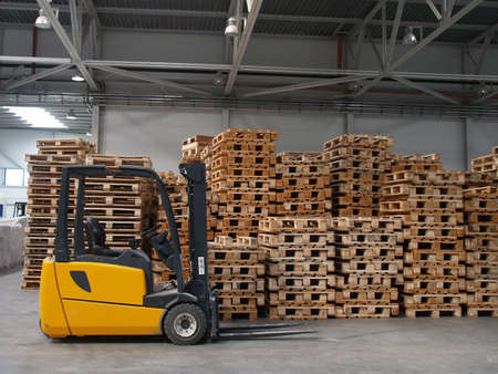 Forklift ready for work in a real warehouse    の写真素材
