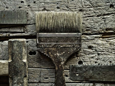 Old tools over grungy wood backgroundの写真素材