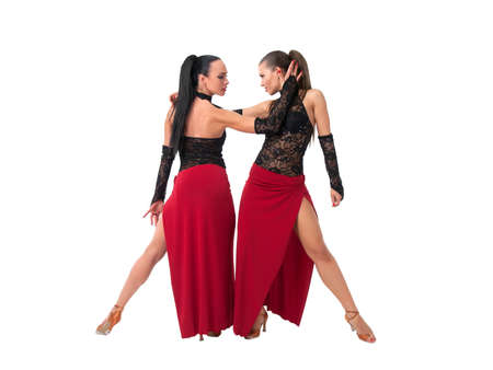 Tango dancers in red and black over white backgroundの写真素材