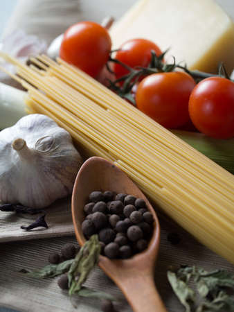 Ingredients for pasta - tomatos, garlic, pepper, cheese, pasta
