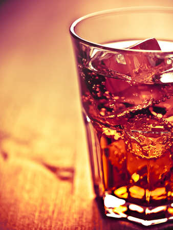 Glass of cold drink over iceの写真素材