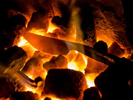 Blazing furnace with burning coal at the blacksmith'sの写真素材
