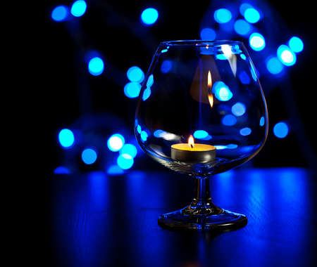 Romantic night with candlelight and bokeh background.New year or romantic valentine Dayの写真素材