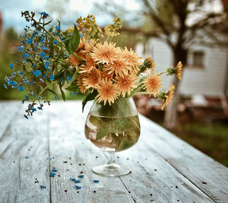 bouquet with forget-me-not and dandelionsの写真素材