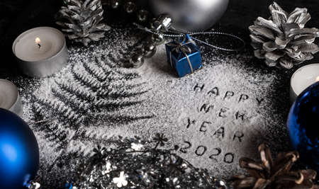 New Year 2020 background. Silhouette of flour on blackbackground