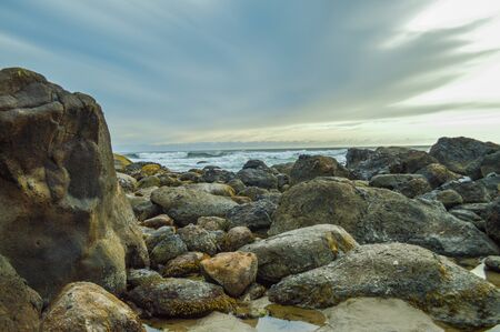 Beach rocks at sunsetの写真素材