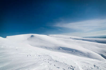 A large field covered with snow in Kirovsk, a ski resort in Russia in the Arctic Circleの写真素材