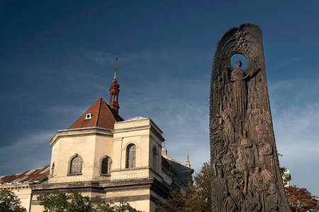 Monument to the poet Taras Shevchenko is set in a central square in Liberty Square in the city of Lviv. Central Church on the background of the monumentのeditorial素材