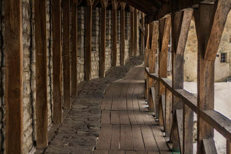 The wall of the tower and parts of red-brick castle-fortress in the city of Kamyanets-Podolsky in western Ukraine, winterのeditorial素材