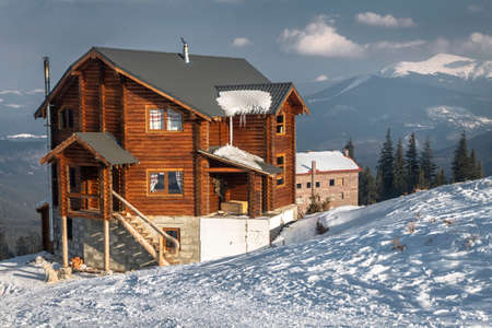 A high cottage in the snow at a ski resort in the Carpathian Mountainsのeditorial素材
