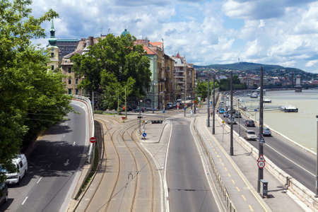 Embankment of the historical part of Buda Budapest city. Road near the Danube river, the tram rails and road signsの写真素材