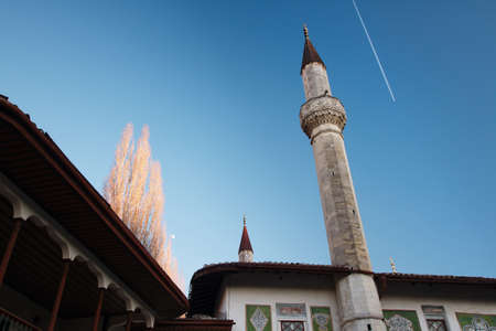 High stone minarets on the territory of Bakhchisarai Palace in Crimea autumn evening, under the moonのeditorial素材