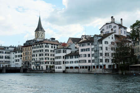 Switzerland, Zurich - May 10, 2019: View of the historic center of Zurich from the canal side on a summer cloudy dayのeditorial素材