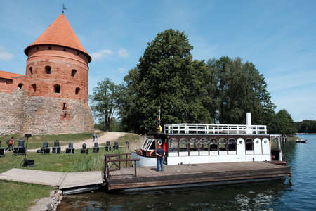Summer view to Trakai medieval red brick castle of Lithuania with blue sky and clouds