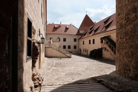 Summer view of the interiors and exteriors of the Bauskai castle with ruins and a renovated part in...