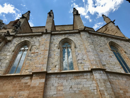Montblanc, Spain, June 2019 - A stone church with a clock on the side of a building. High quality photoの写真素材
