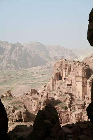 Petra, Jordan, November 2019 - A canyon with a mountain in the background. High quality photoの写真素材