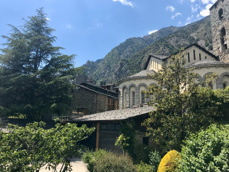 Andorra la Vella, Spain, June 2019 - A large stone building with a mountain in the background. High quality photoの写真素材