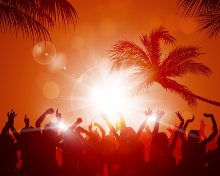 party crowd raving among palms before sunsetの写真素材