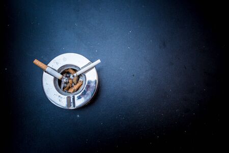 cigarettes and ashtray. hoping for a better lifeの写真素材