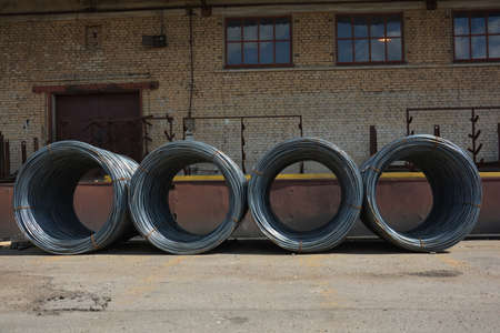 Armature bundle. Steel coil bars. Flake metal. Metallurgical production, production, steel rods or bars used to reinforce concrete. Parcel rods.の写真素材