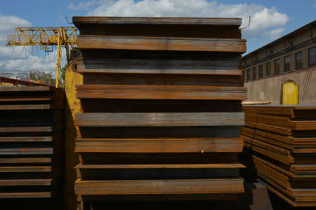 Steel plate. Metal sheet. Hot-rolled flat steel. Metal leaf. Rusty ferrum. Heavy steel plates. Metal sheets in warehouse.の写真素材