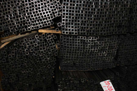 Steel tube. Metal pipe. Steel rolled bar. Stuck of steel pipes. Steel pipe bundle in industrial stockyard.の写真素材