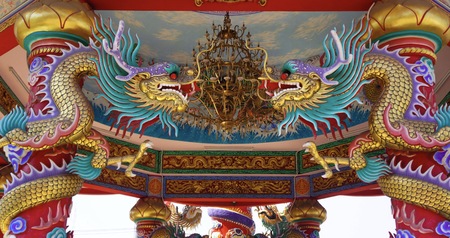 colorful dragon on top roof in the blue sky. Dragon is show power authority of king and majestyの写真素材