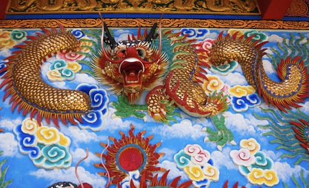 colorful dragon on top roof in the blue sky. Dragon is show power authority of king and majestyの写真素材