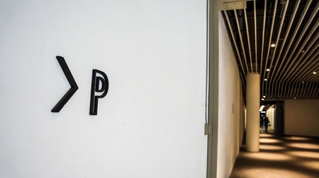 Parking sign and symbol point to parking area.の写真素材