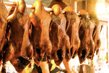 Pot stewed duck hanging in front of Chinese restaurant.の写真素材