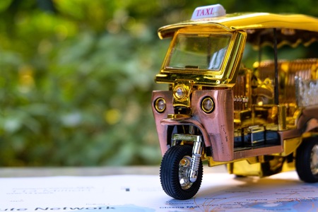 Beautiful tricycle taxi in BANGKOK which it is transportation mascot and popular in Thailand. If you come to Thailand , you should to try.の写真素材