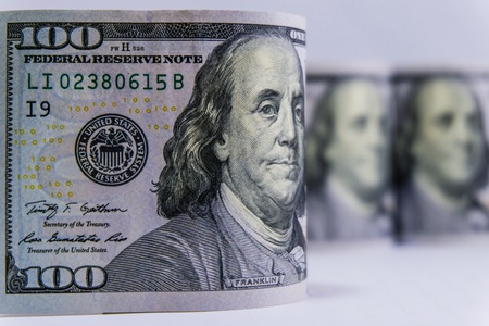 Close up US Dollar rolls on white background concept.の写真素材