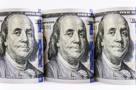 Close up US Dollar rolls on white background concept.の写真素材