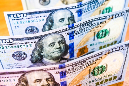 close up one hundred 100 dollar banknotes. Benjamin Franklin on paper for America cash payment earning concept.の写真素材