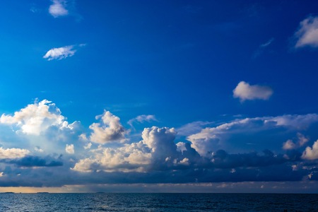 White clouds with blue sky background which the clouds make before storm appear.の写真素材