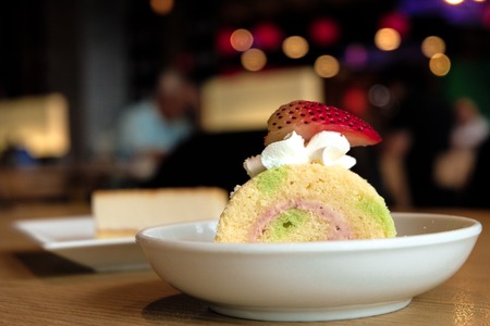 Strawberry cheese cake on white dish in the dessert restaurant.