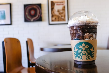 BANGKOK,THAILAND - JUNE 6,2018: The Starbucks ice coffee with cream on table. Starbucks  is the biggest American coffee cafe establish since 1971 at Seattle Washington DC which is famous in the world.のeditorial素材