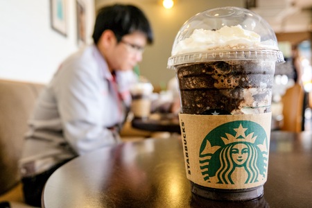 BANGKOK,THAILAND - JUNE 5,2018: The Starbucks ice coffee with cream on table. Starbucks  is the biggest American coffee cafe establish since 1971 at Seattle Washington DC.のeditorial素材