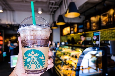 BANGKOK,THAILAND - JUNE 5,2018: The Starbucks ice coffee with cream. Starbucks  is the biggest American coffee cafe establish since 1971 at Seattle Washington DC which is famous in the world.のeditorial素材
