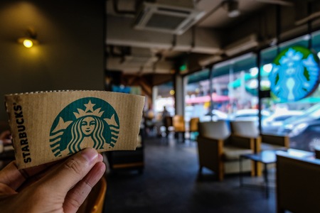 BANGKOK, THAILAND - JUNE 5, 2018: The Starbucks paper logo. Starbucks  is the biggest American coffee cafe establish since 1971 at Seattle Washington DC which is famous in the world.のeditorial素材