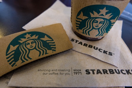 BANGKOK, THAILAND - JUNE 6, 2018: The Starbucks paper logo and napkin. Starbucks  is the biggest American coffee cafe establish since 1971 at Seattle Washington DC which is famous in the world.のeditorial素材