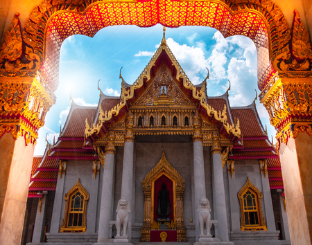 Beautiful Thai architecture of mable temple gate with blue sky and clouds at Bangkok Thailandの写真素材