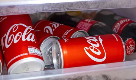 BANGKOK, THAILAND - OCTOBER 23, 2018: Coca-Cola cans and bottle at home refrigerator. Coca-Cola is a carbonated soft drink sold in stores and restaurants throughout the world.のeditorial素材