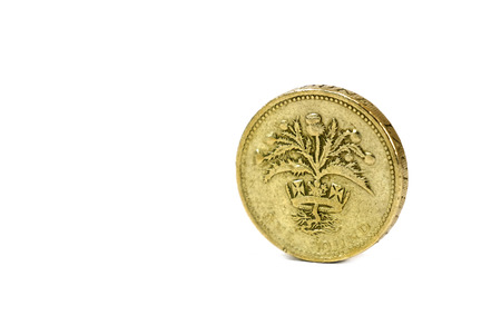 Close up isolated of one pound coin from united kingdom on white backgroundの写真素材