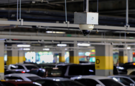CCTV or Close Circuit Television are monitor and record cars in parking lot of shopping mall to prevent robbery and security.の写真素材
