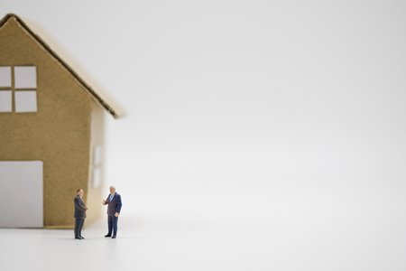 Two business men discuss of home and real estate for agreement investment. Real estate investor concept.-Image.の写真素材