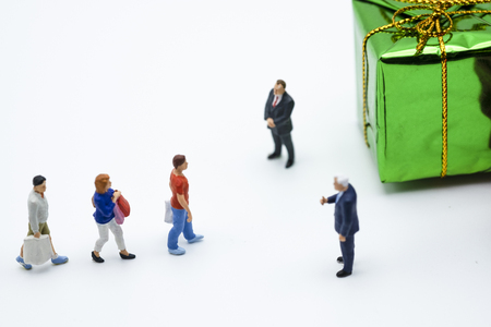 Miniature shopper : Men and women hand carry shopping bag and walk on white background. Buy and sale  items using as shopping business concept.-Image.の写真素材