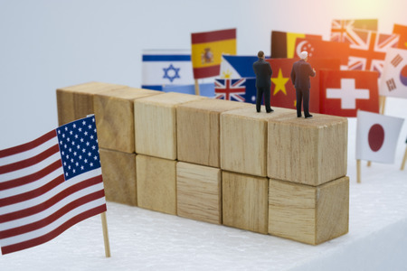 USA China and multi countries flags with wooden fence. It is symbol of America first policy and...