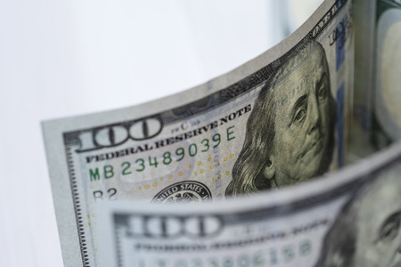 Closeup Benjamin Franklin face on one hundred US dollar banknote.-Image.の写真素材